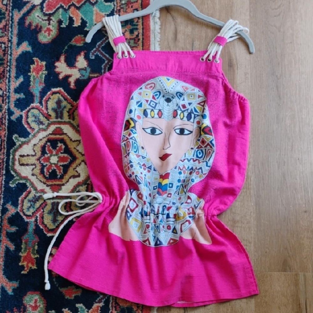 Vibrant Pink Top with Artistic Face Design